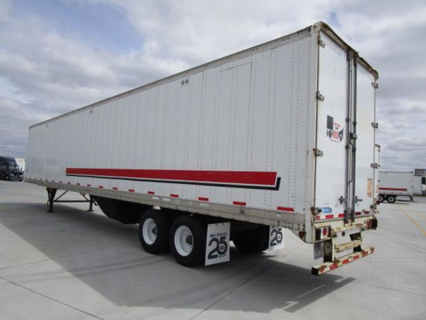 Stoughton 2014 van trailer side and rear view showing white exterior with red stripe and dual rear doors.
