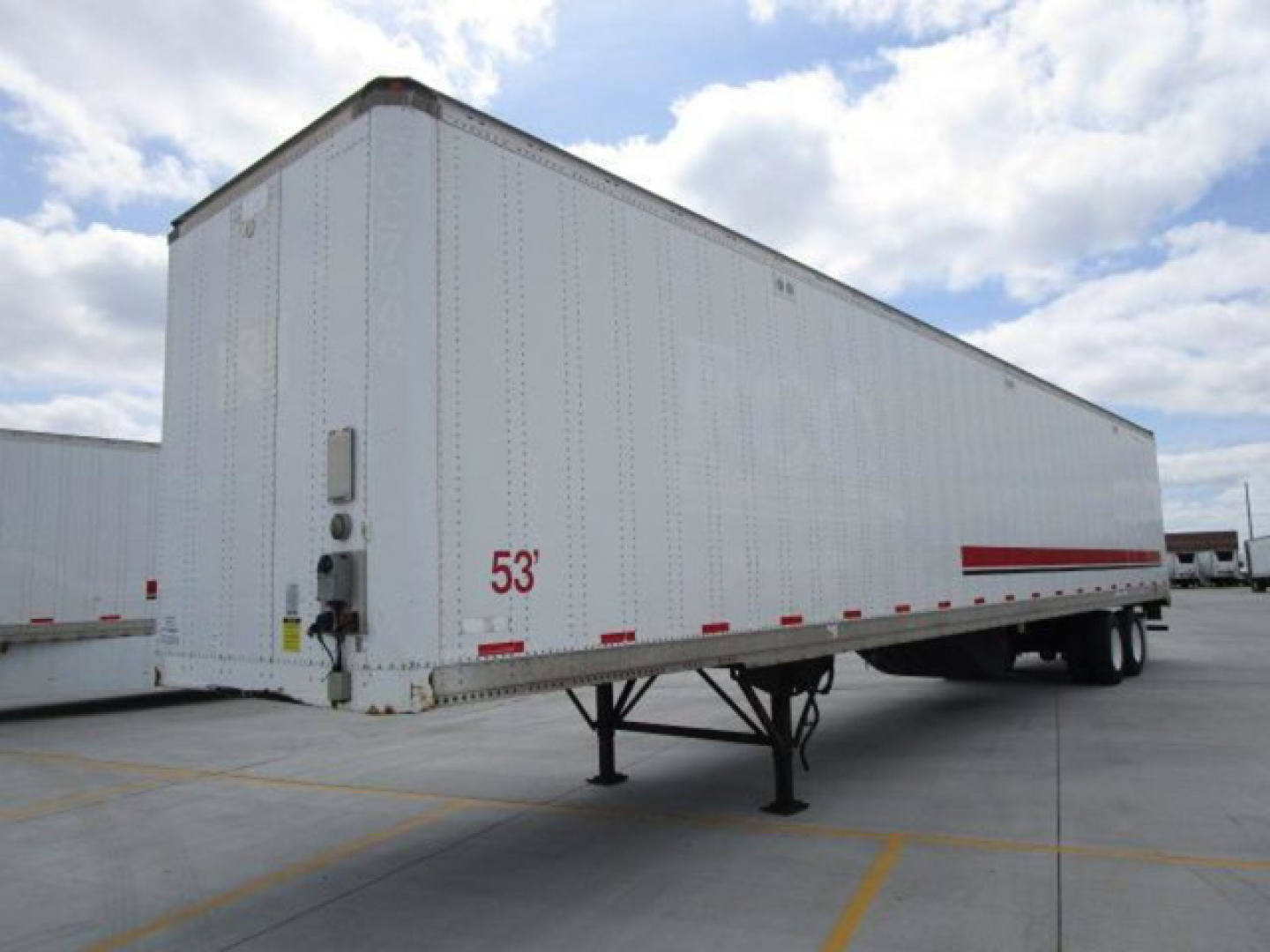Stoughton 53’ van trailer showing side view with landing gear and wheels