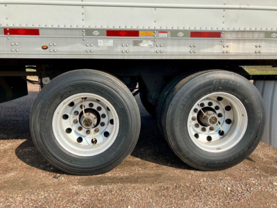 Dual rear axles of a 2019 Utility Reefer trailer showing wheels and tires.