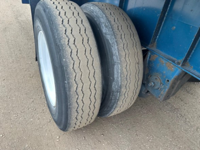 Dual rear trailer tires on Great Dane Freedom LT flatbed trailer showing tread pattern and wear.