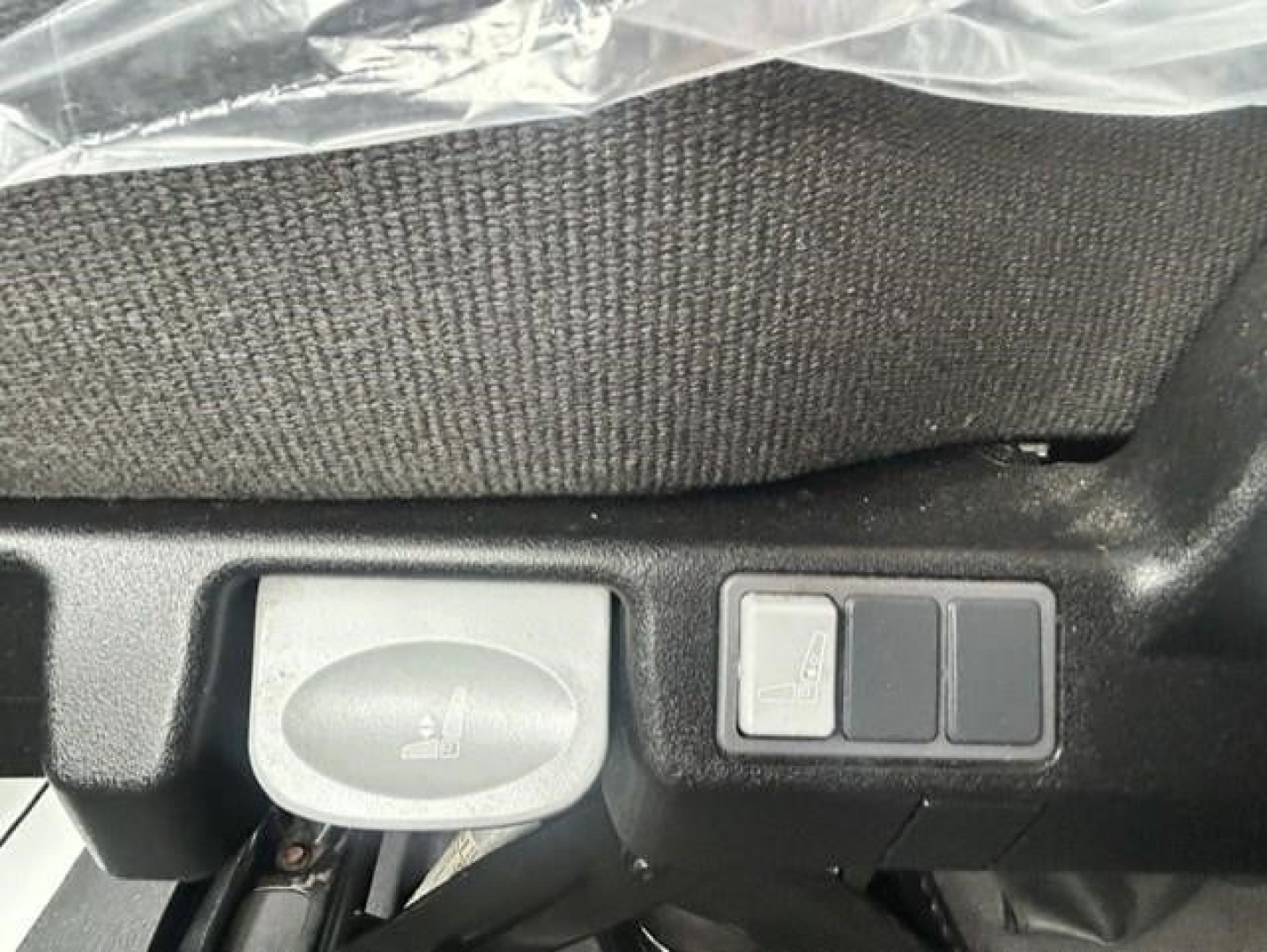 Freightliner Cascadia 126 dash area showing control stalks and switch panel on driver side.