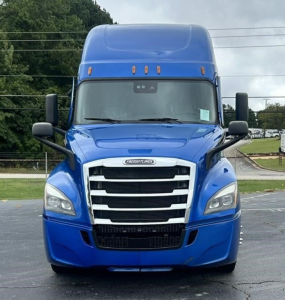 Front view of a blue 2022 Freightliner Cascadia 126 conventional sleeper truck showing grille, headlights, and large cab.
