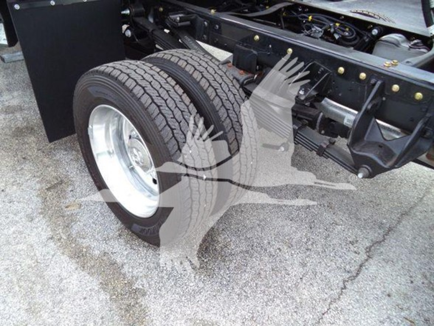 Ram 5500 chassis showing dual rear wheels and suspension components.