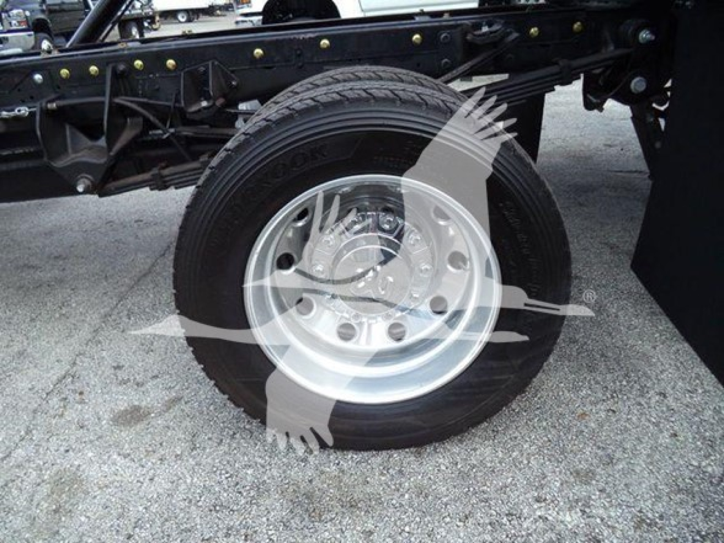 Rear truck wheel with metal rim and tire on Ram 5500 chassis showing component detail.