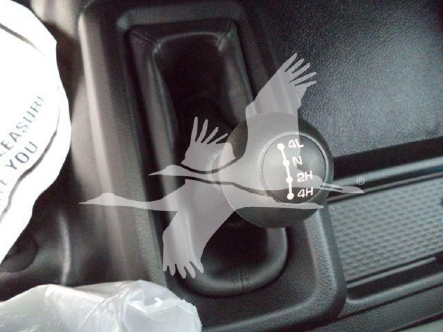 Ram 5500 transmission selector knob with 2H 4H etc visible, inside cabin area near gear shift