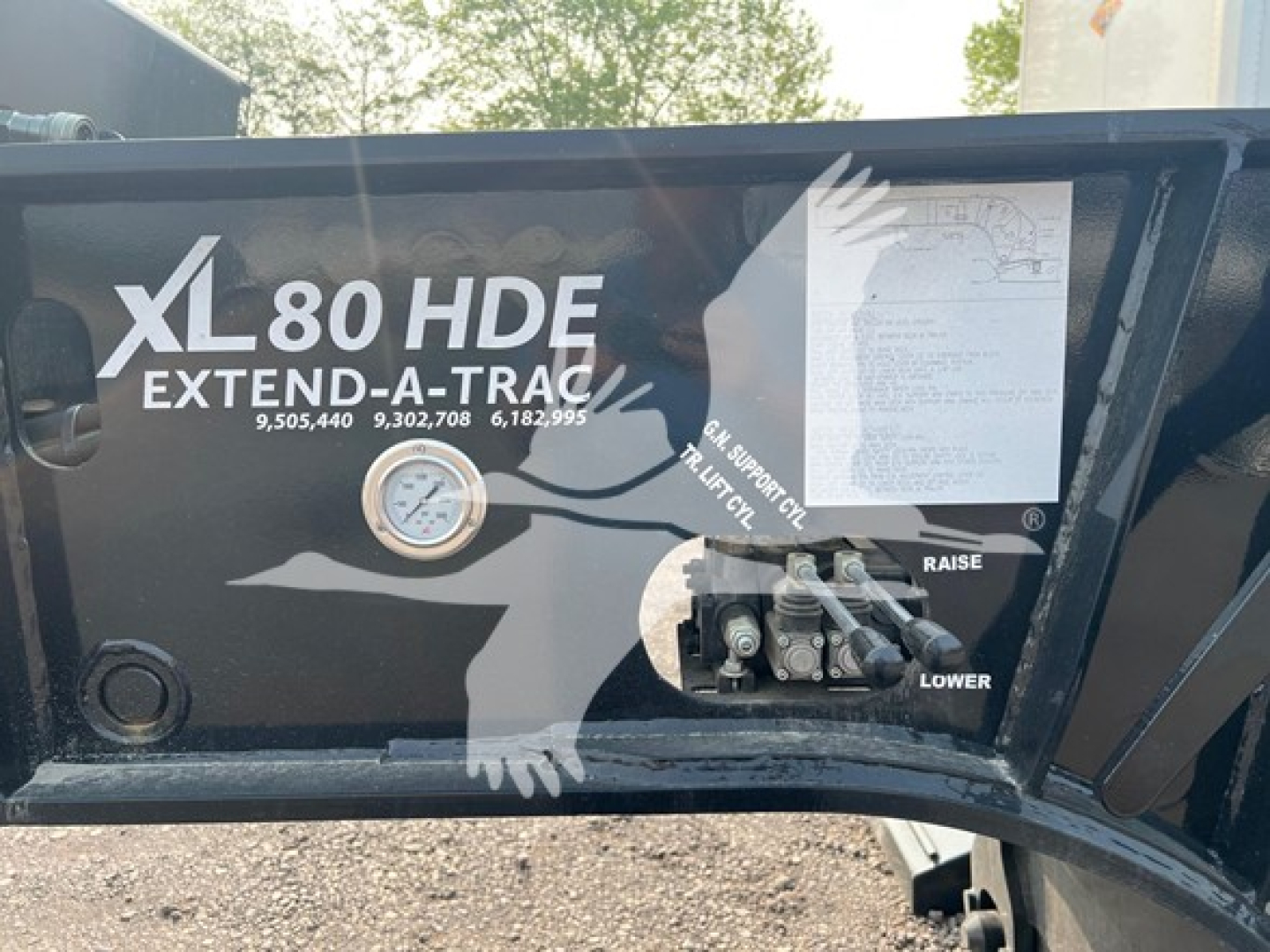 XL80HDE Extend-A-Trac trailer control panel with gauge and labels showing XL80 HDE Extend-A-Trac, with raise/lower lever and diagram label.