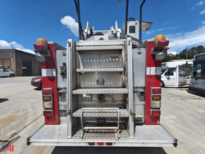 Emergency One Quint Ladder Truck rear with metal compartments and ladder well, safety lighting, and rear step.