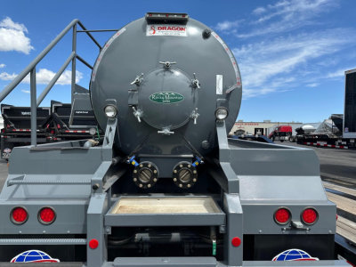 Dragon Vac Tank trailer rear view showing circular tank with bolts and valves, Dragon logo plate, red tail lights, and access ladders.