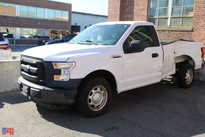 Ford F-150 pickup truck 2015 white two-wheel drive with extended cab and long bed, front grille and headlights visible.
