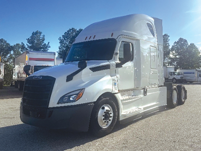 Freightliner Cascadia126 truck shown in side angle with sleeper cab and dual rear axles.