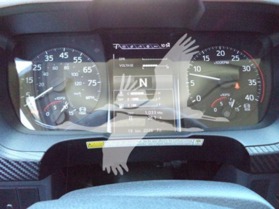 Hino L6 dashboard shows speedometer and tachometer with central digital display reading N in gear and 19 Jun 2026 date; gauges starburst overlay obscures some text.