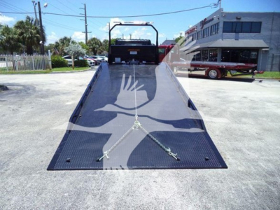 Hino L6 rollback truck bed with loading ramp and ramp safety chains. VIN 5PVNJ7ET5T5T50133 stock J50133.