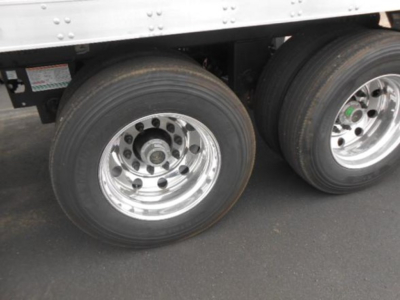 Utility Reefer trailer dual rear wheel close-up showing aluminum rims and tires.