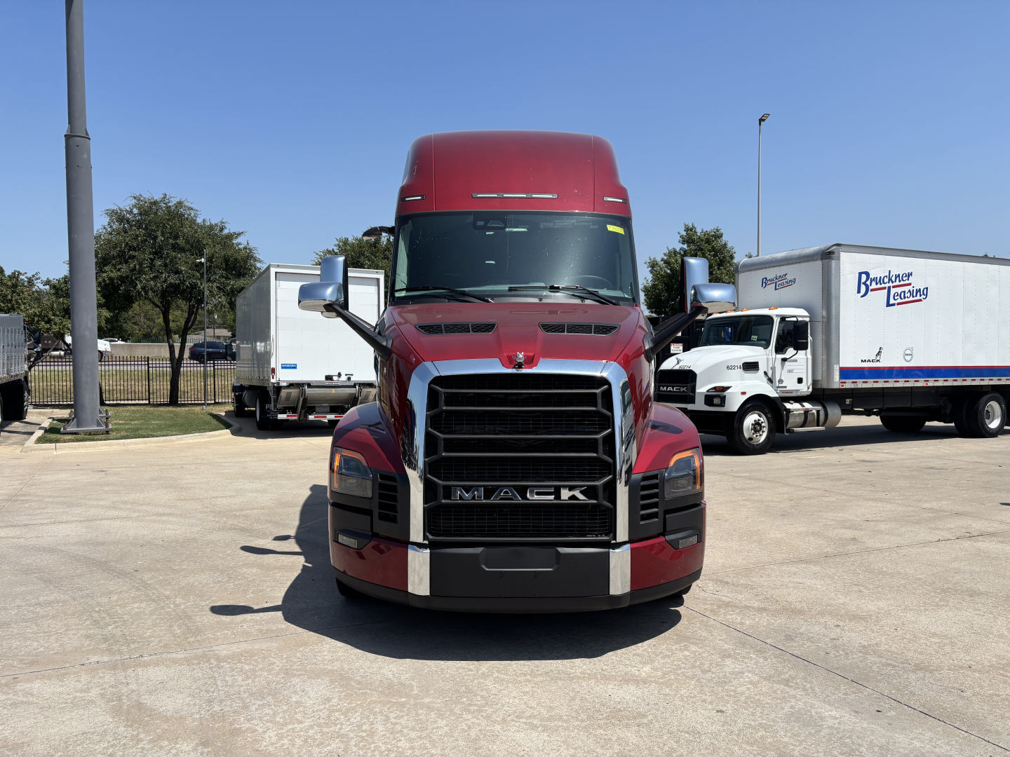 Mack PR64T76H conventional sleeper truck front view showing grille and hood badge.