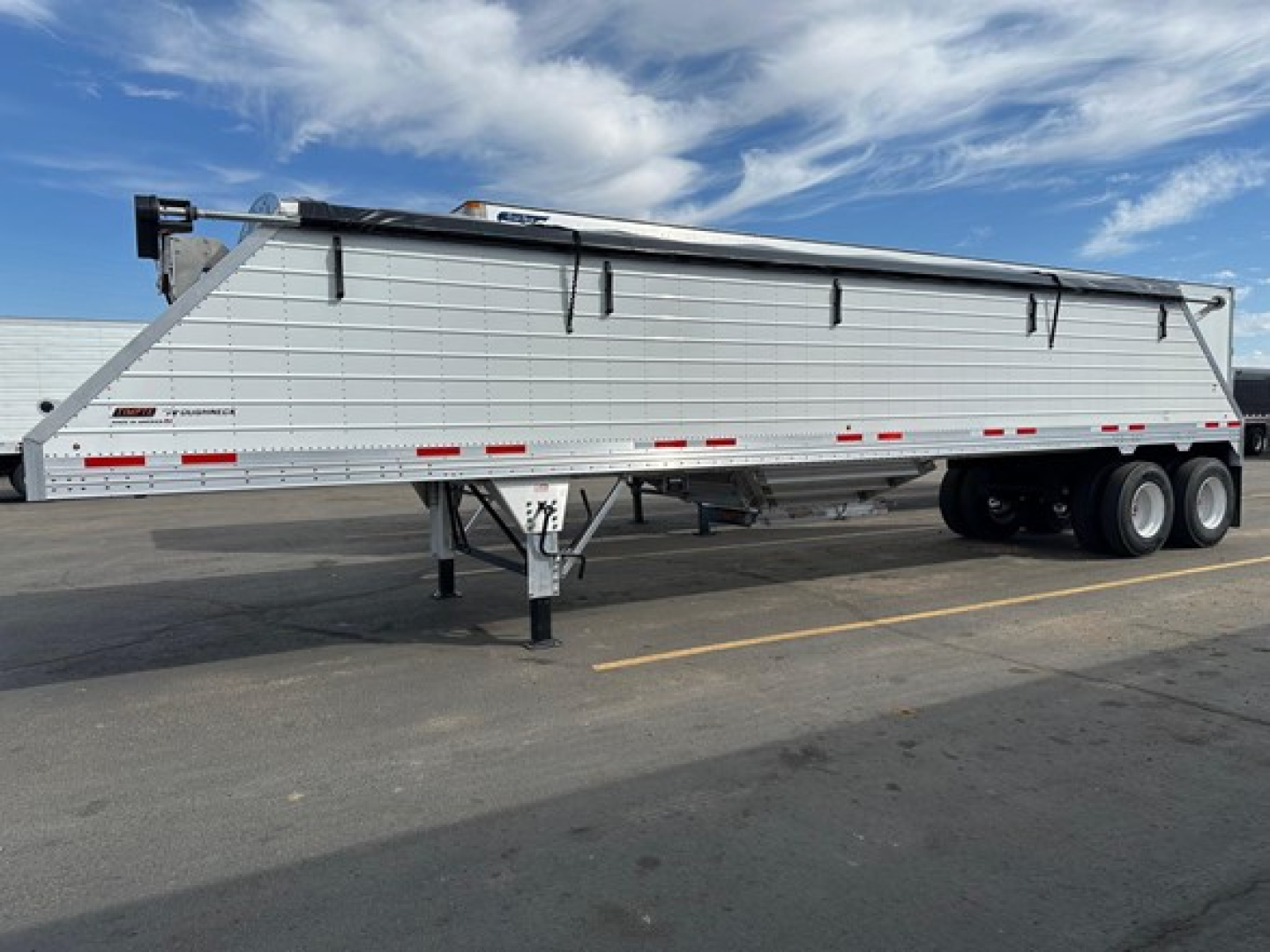 New 2026 Timpte frac sand hopper trailer side view showing cylindrical body, tarp system on top, loading chute, and dual rear axles with tires.