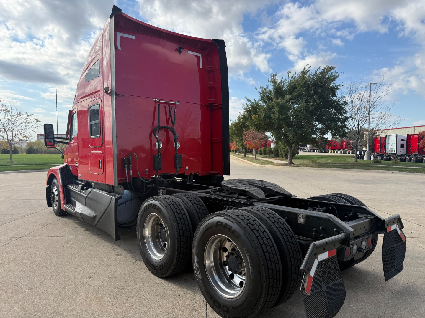 Kenworth T680 truck rear/side showing sleeper cab and dual rear axles with mud flaps.