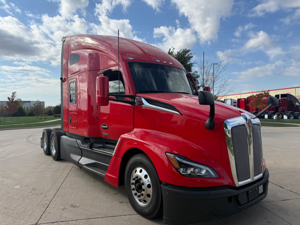 Kenworth T680 tractor-trailer cab in red, front three-quarter view, with grille, headlights, and side mirrors visible; VIN and stock info not shown on image.