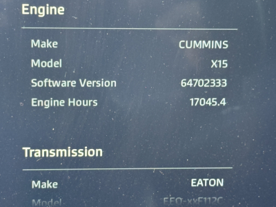 Truck engine label showing Engine: Make Cummins, Model X15, Software Version 64702333, Engine Hours 17045.4; Transmission: Make Eaton, Model FFO-xxxx (partially visible).