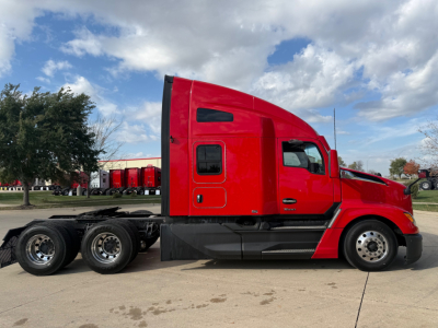 Kenworth T680 side profile showing red sleeper cab and rear tractor wheels, VIN 1XKYD49X4RJ344585 on listing, stock 0632738, conventional sleeper truck.