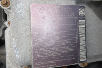 Engine identification plate on International PROSTAR showing model and weight specs.