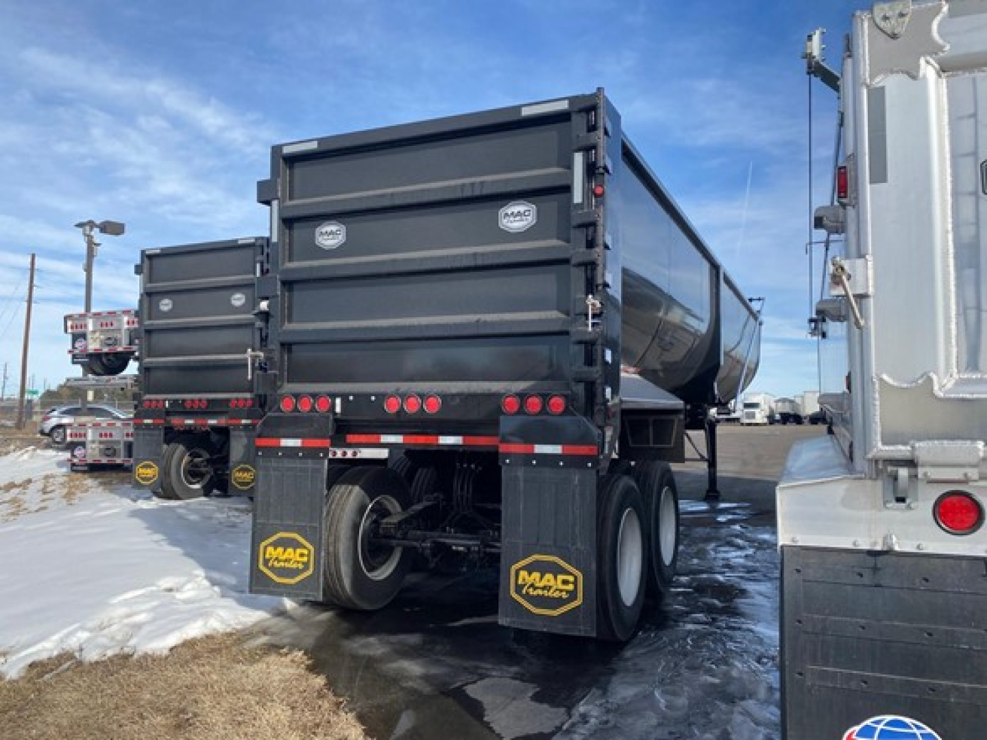 Mac High Cube 76-inch side scrap trailer rear view showing dual rear doors and MAC trailers mud flaps.