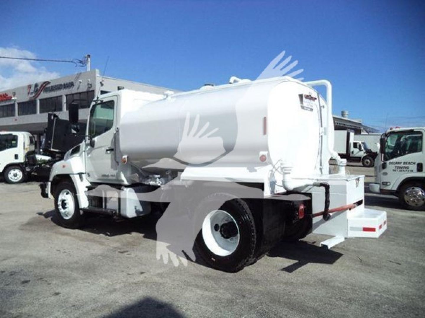 2019 Hino 338 street-side view of a white vacuum tanker truck with stock number T50534 and VIN 5PVNV8JG6K4S50534.