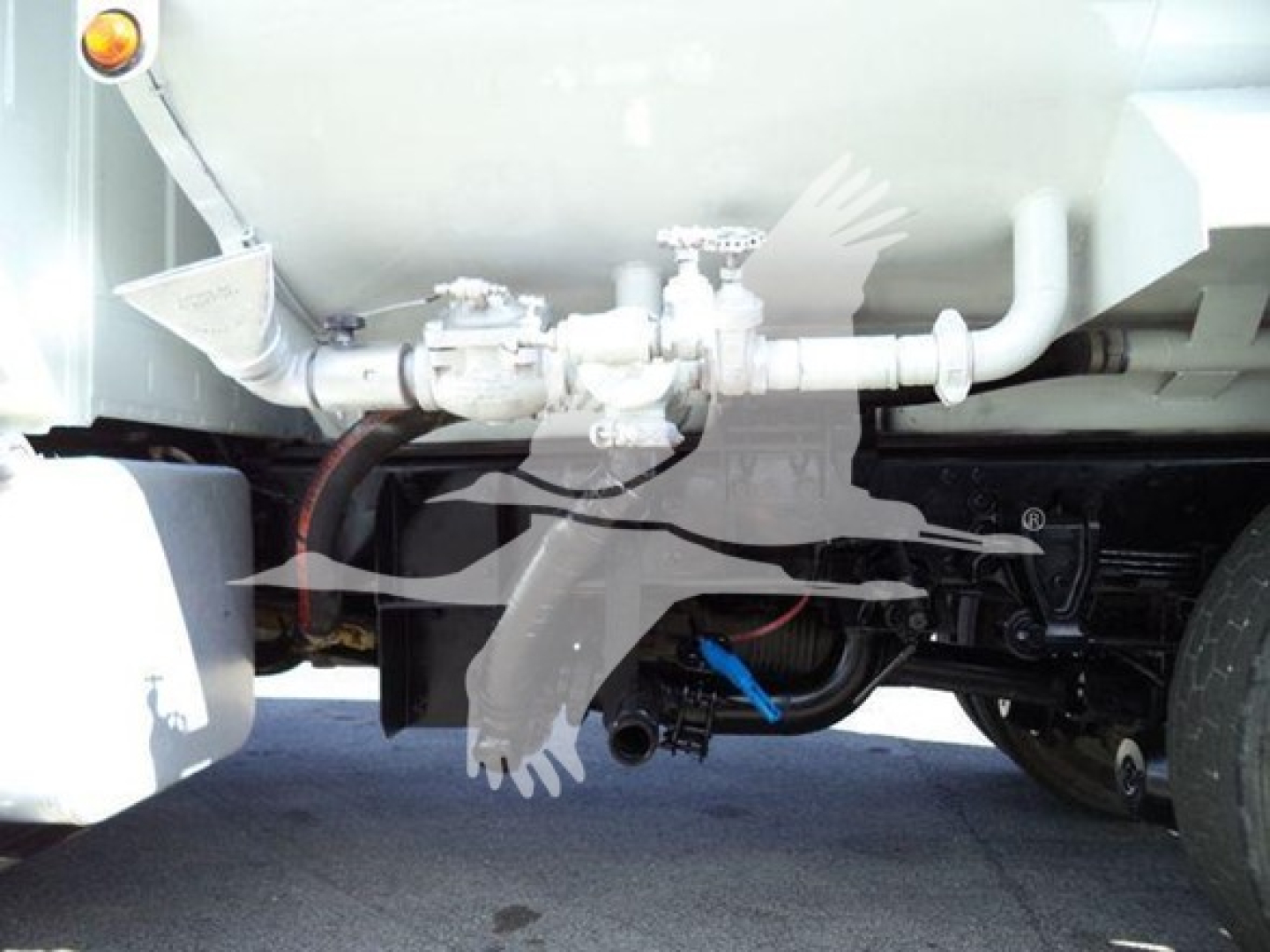Truck fuel/tuel system undercarriage showing gas/air lines and valves with Hino chassis components.