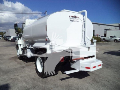 Rear-quarter view of a white 2019 Hino 338 vacuum or water tanker truck with cylindrical tank, rear bumper, and taillights.