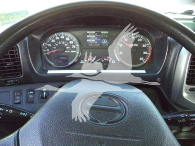 Dashboard of a 2019 Hino 338 truck showing instrument cluster and steering wheel with digital display.