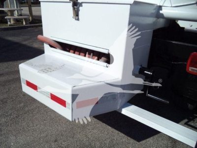 Rear view of a white Hino 338 truck bed bumper with red reflectors and a storage box mounted at the back.