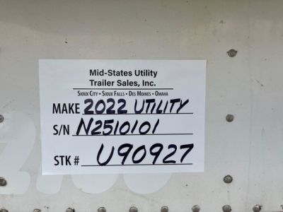 Sticker on trailer showing Make 2022 Utility; S/N N2510101; STK # U90927; Mid-States Utility Trailer Sales sign listing locations.