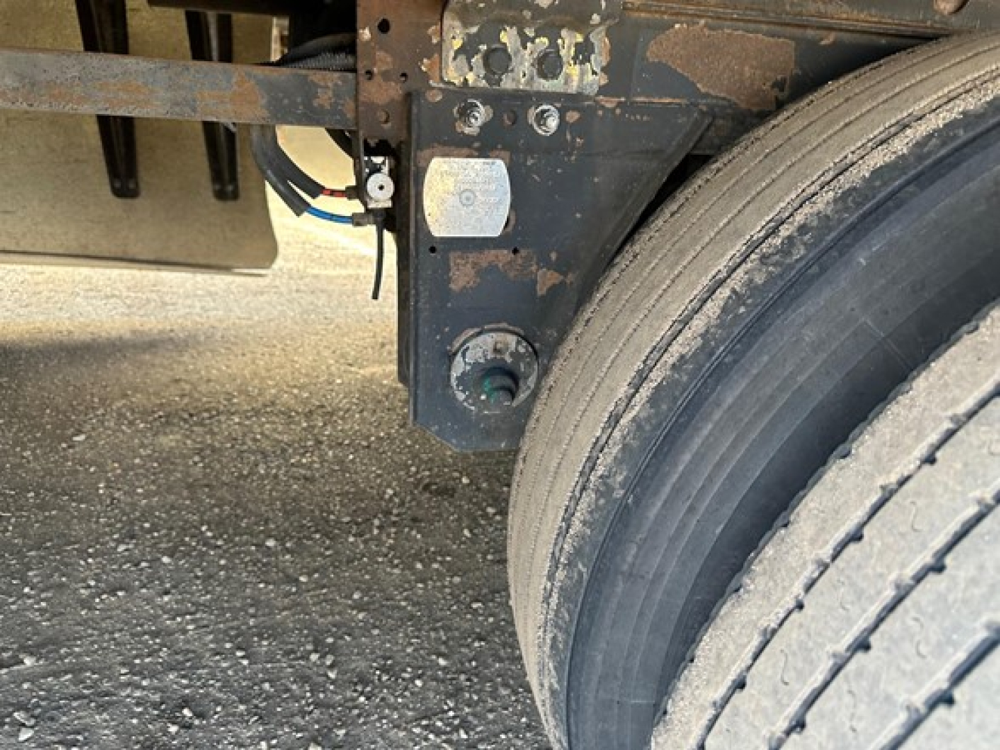 Trailer wheel and undercarriage of a 2017 Utility 3000R reefer trailer showing dual tires, frame, and impact of weathering; no text visible.