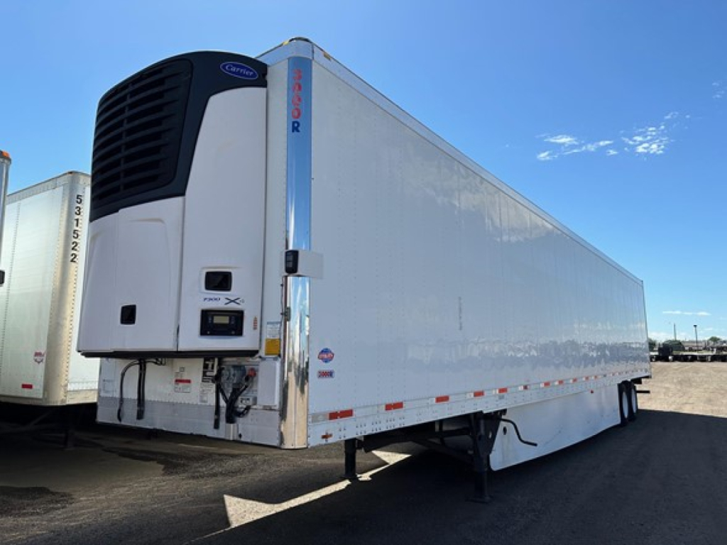 Reefer trailer showing Thermo King fridge unit on 2017 Utility 3000R with white body, side loader and landing gear visible.