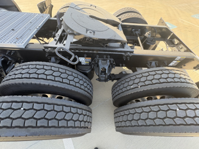 Peterbilt 579 truck chassis with dual rear axles and spare drive line components visible.