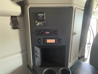 Peterbilt 579 cab interior dashboard panel with controls and digital display area visible.