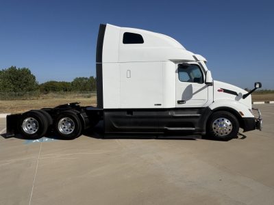 Peterbilt 579 tractor unit side profile showing sleeper cab and dual rear axles