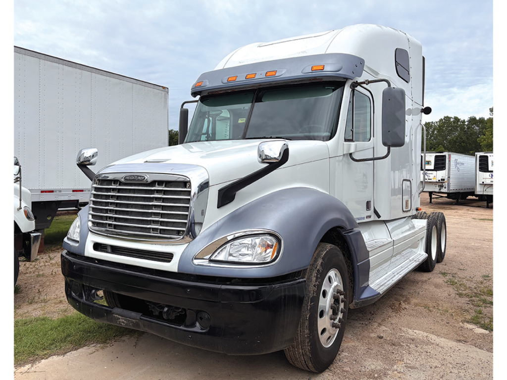Truck cab side view of a white 2012 Freightliner CL120 Columbia with gray fenders, chrome grille, and sleeper cab.