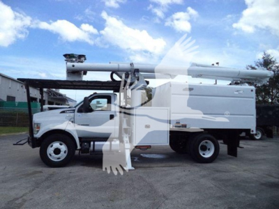 Ford F750 bucket truck side view showing crane arm and utility body with bucket platform.