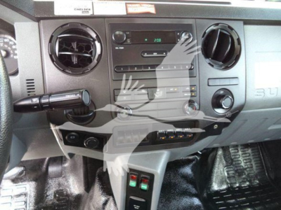 Ford F-750 dashboard center console showing radio, climate controls, and USB/aux ports.