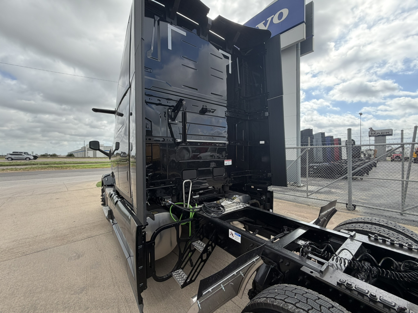 Mack PR64T76H truck cab and chassis showing engine bay and chassis rails with wheels and cab interior visible.