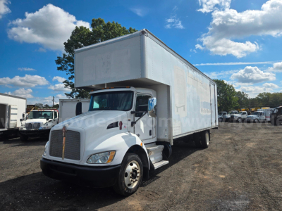 Kenworth box truck 2018, side view showing cargo box with cab in foreground and clear sky.