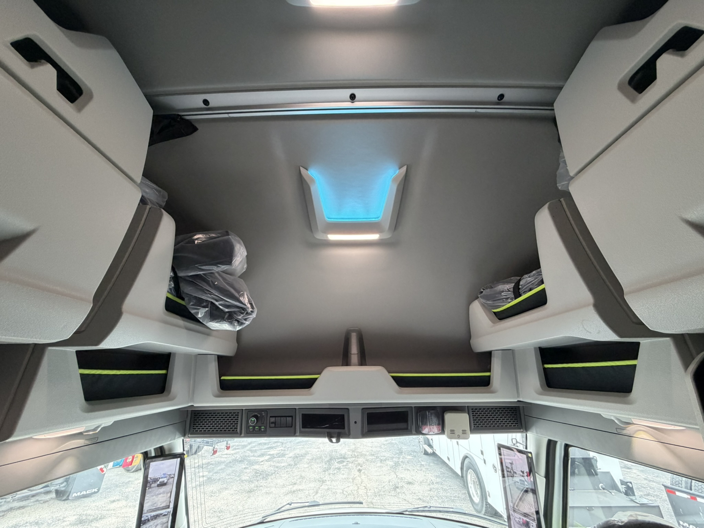 Volvo VNL64T860 sleeper cab interior ceiling view with overhead storage compartments and skylight showing cabin layout.