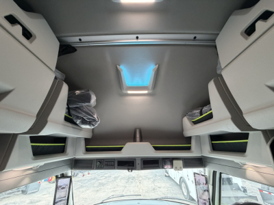 Volvo VNL64T860 sleeper cab interior ceiling view with overhead storage compartments and skylight showing cabin layout.