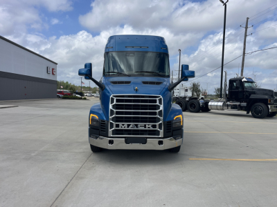 Front view of a blue 2027 Mack AN64T64 sleeper truck with prominent grille and MACk badge.