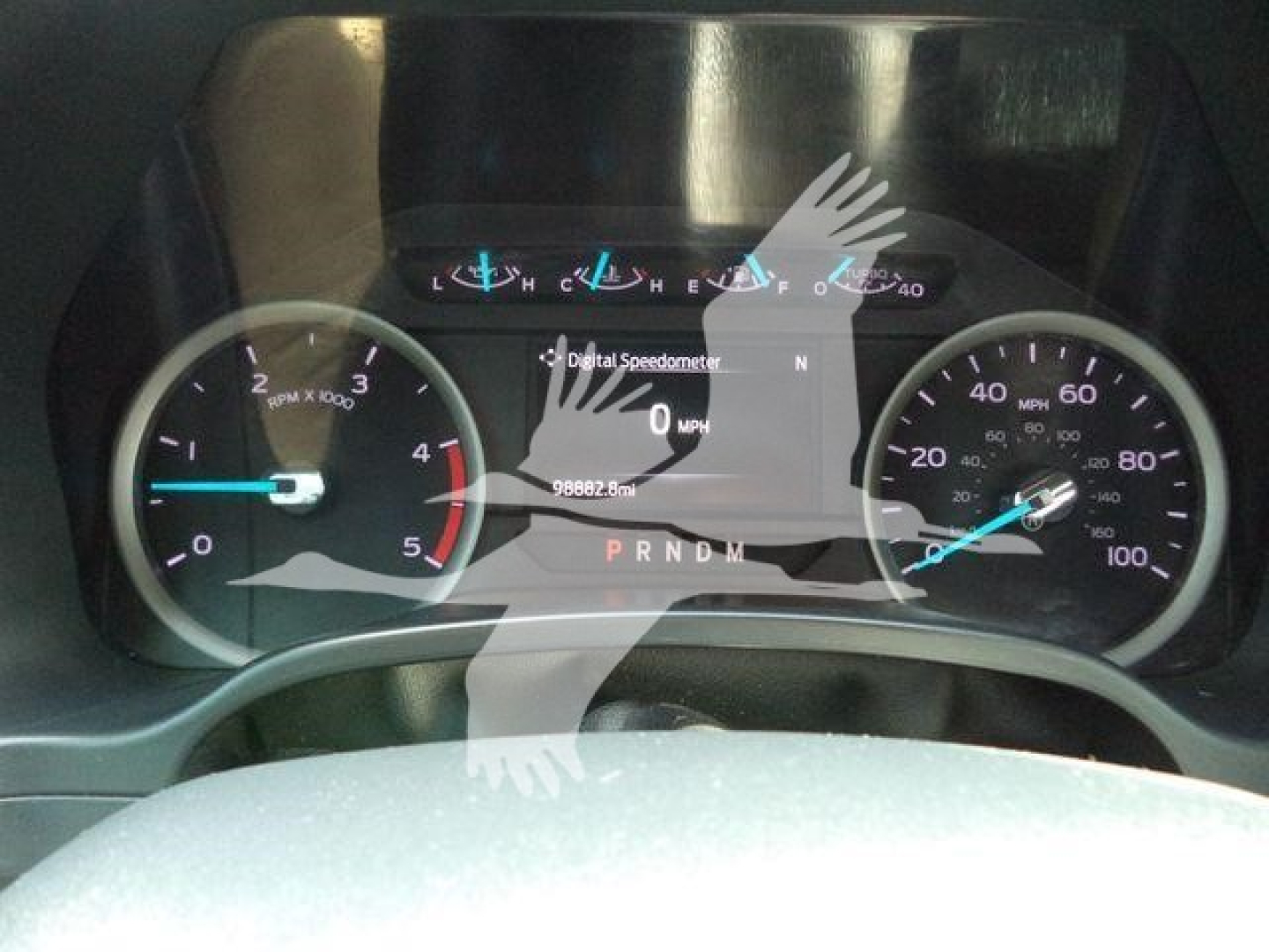 Dash of a 2022 Ford F600 showing instrument cluster with tachometer, speedometer, and digital speedometer readout; gear indicators PRNDL visible.