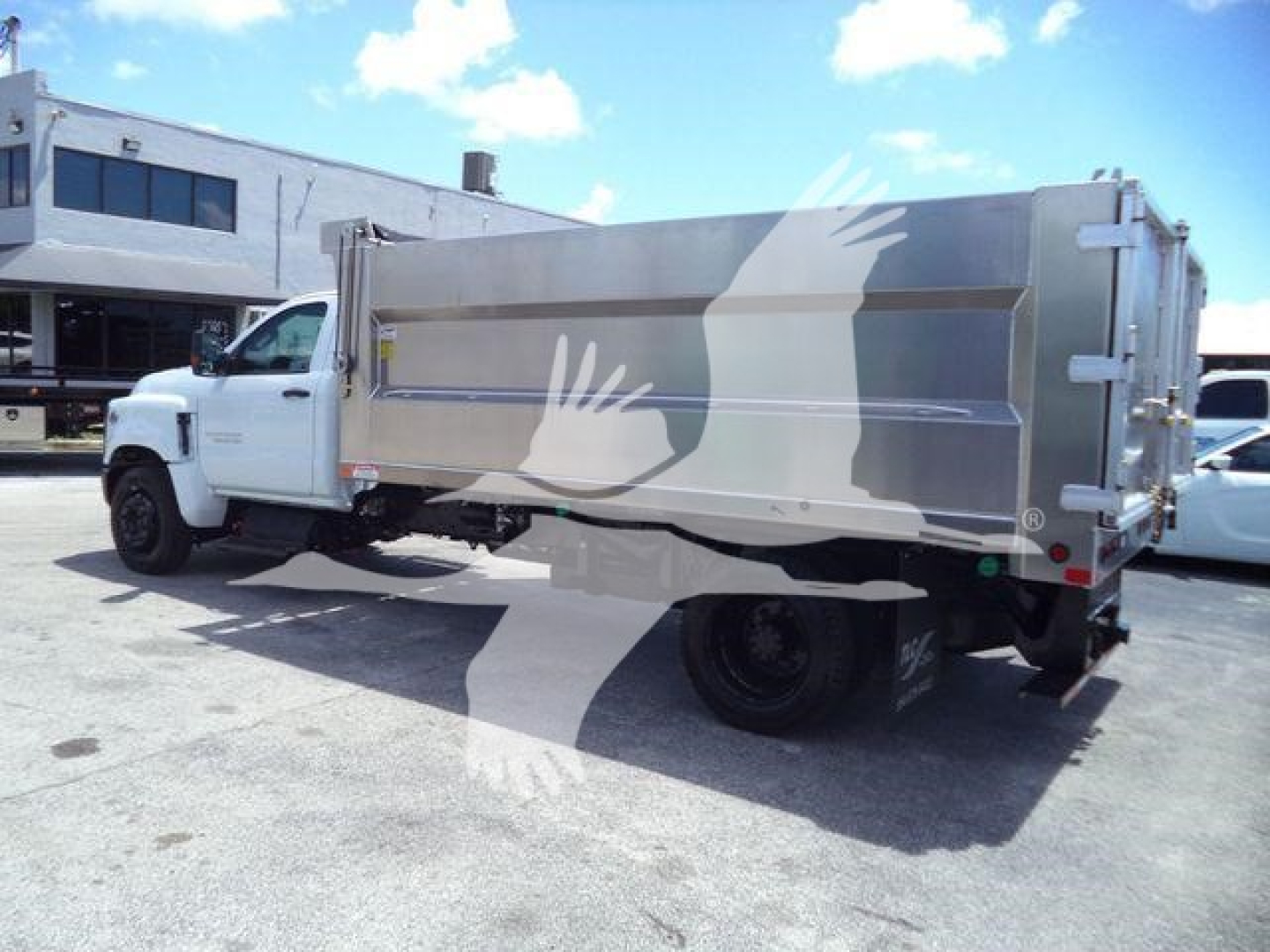 Dump truck bed with aluminum sides on a white Chevrolet Silverado 6500HD cab, stock number 6500ALUMDMP, category Dump, new vehicle.
