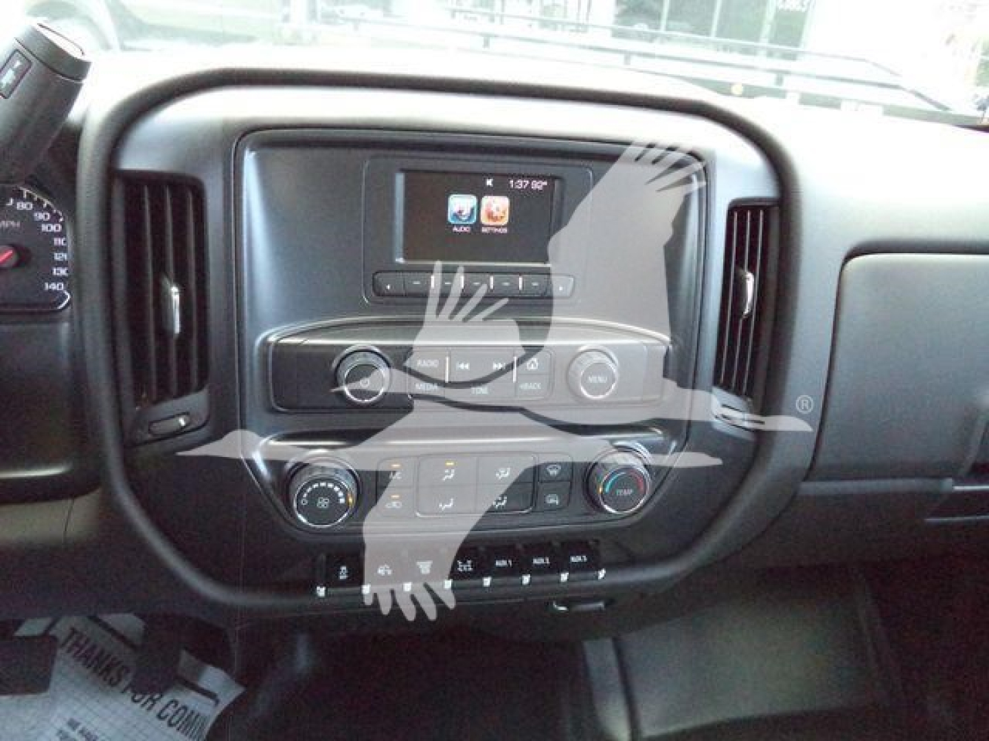 Chevrolet Silverado 6500HD dashboard view showing center touchscreen and climate controls in the cab interior.