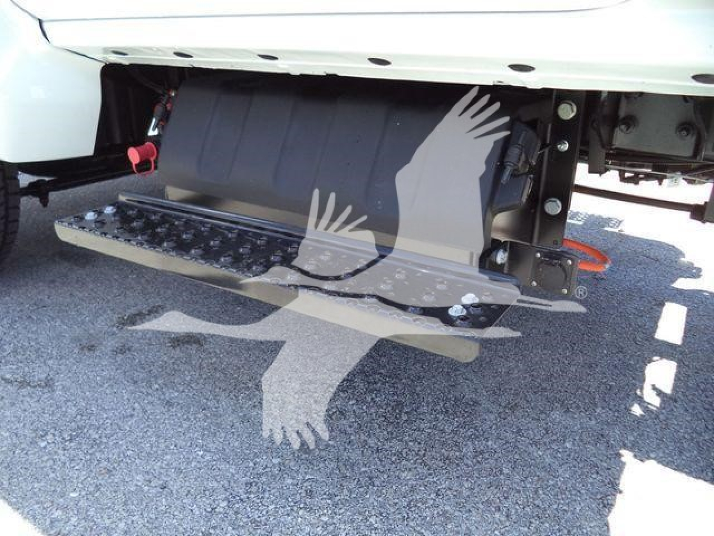 Chevrolet Silverado 6500HD dump truck side view showing side step and undercarriage components.