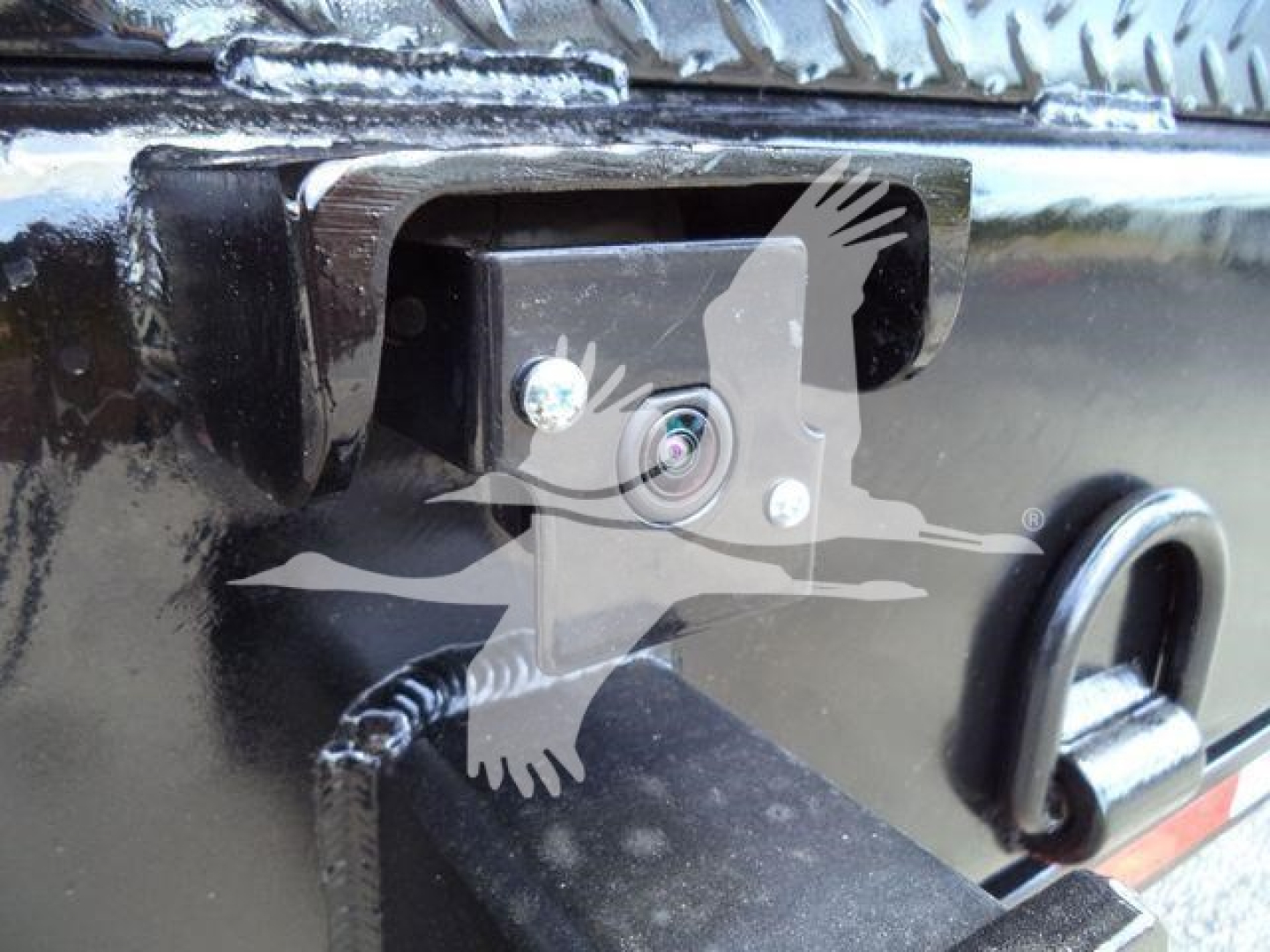Chevrolet Silverado 6500HD truck tailgate area with rear camera and hitch area visible.
