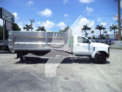 Side view of a white 2023 Chevrolet Silverado 6500HD dump truck with aluminum dump body. Visible textArea not readable. 